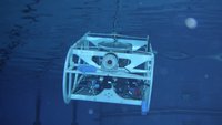 A cubic machine sinking into the ocean, the AUV in action